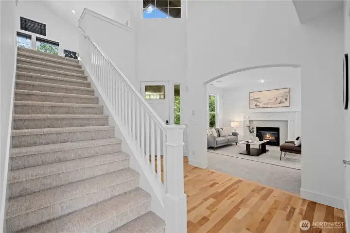 Open staircase with Craftsman style hand rail and open newels continues the Craftsman inspired design to the second level. The foyer is a beautiful room in itself, purposefully designed to elevate the atmosphere of the home.