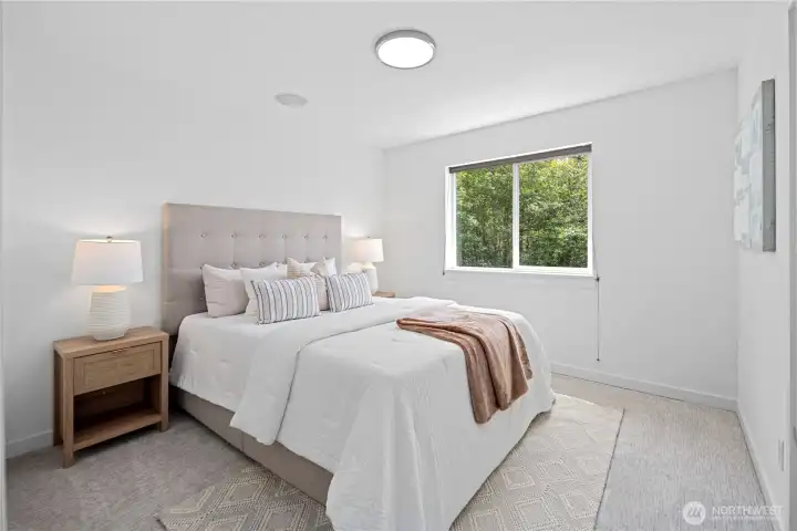 The third upstairs guest bedroom completes the cluster with new carpet, fresh paint, a large closet, and plenty of room to make the space your own. A large south facing window with blinds keeps the room bright and comfortable, while the new round flush-mount ceiling light adds a clean, gentle glow. The home’s built-in speaker system adds music and ease throughout the upstairs living spaces.