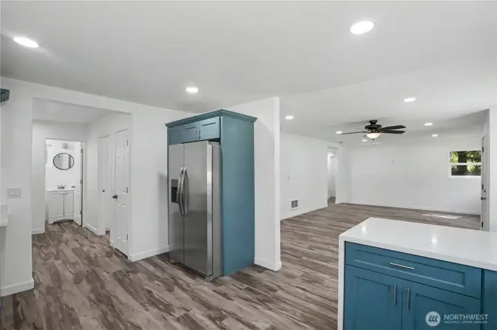 From the kitchen is the laundry room and 3/4 bathroom.