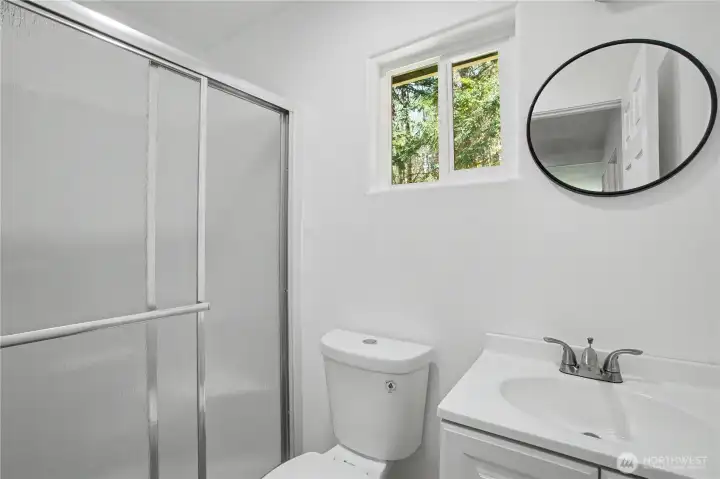 Bathroom off of kitchen & laundry room