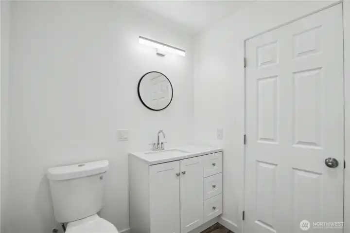 Second bathroom downstairs, this one has bathtub and shower.