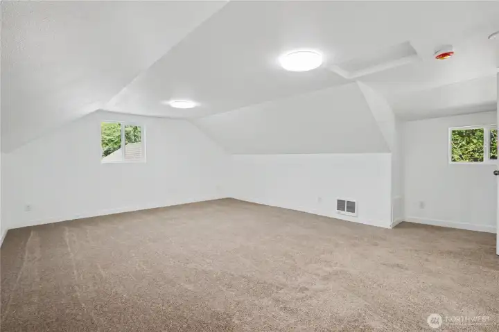 Upstairs could be the primary bedroom or bonus room.
