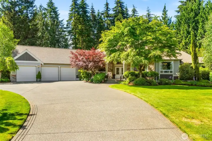 A circle driveway offers easy access in and out with abundant guest parking.