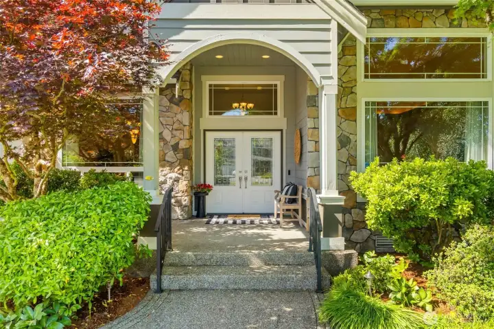 The welcoming covered front porch welcomes your guests with the fragrance of daphne blossoms!