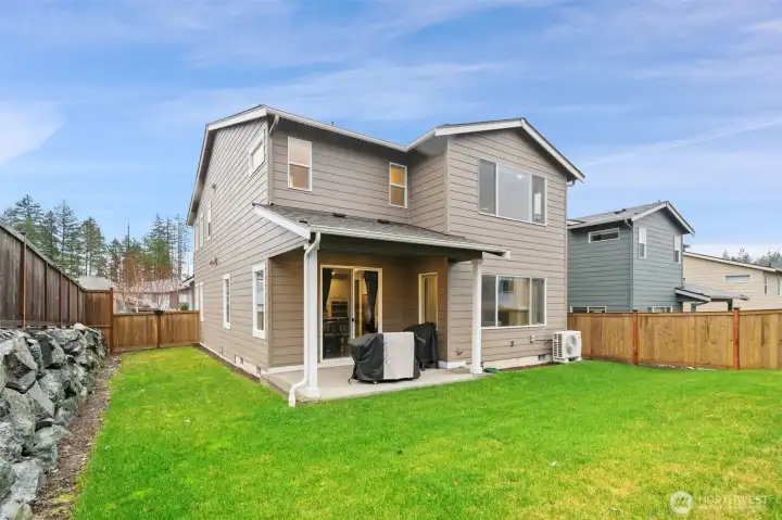 Fully fenced backyard w/ covered patio Fully fenced backyard w/ covered patio