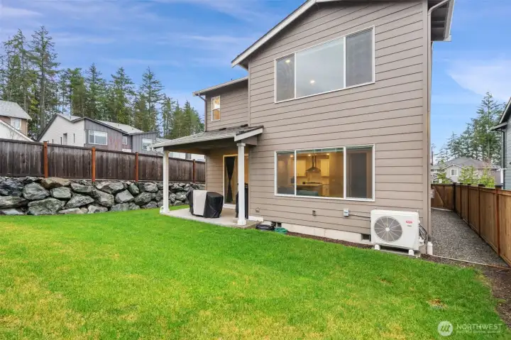 Fully fenced backyard w/ covered patio Fully fenced backyard w/ covered patio