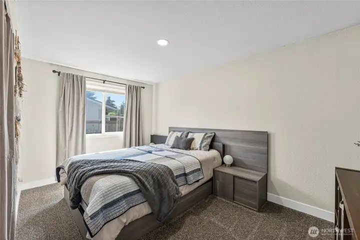 Third bedroom with built-in head board, new carpet