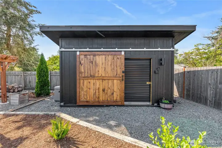 Barn door opening to garage door for secure access