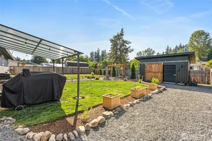 Flexible parking for RVs, boats, and cars with expansive garden area