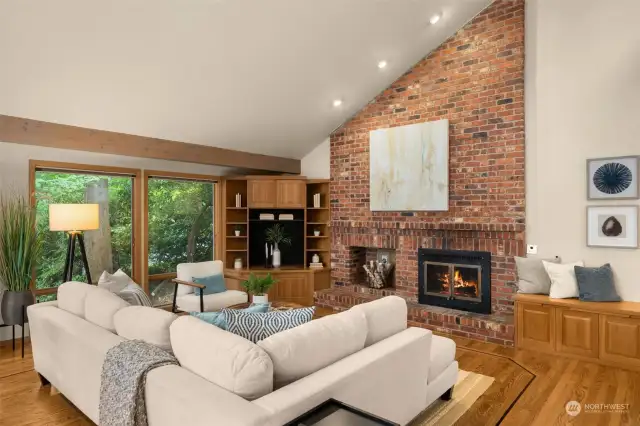 Cozy family room with wood burning fireplace is the perfect gathering place for family and friends.
