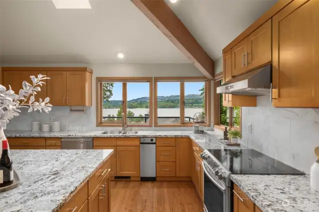 The bright gourmet kitchen, complete with a spacious island, is perfect for seamless entertaining and culinary delights.