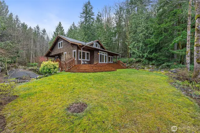 Side view of home and pond with waterfall