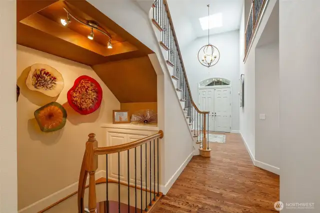 Elegant round staircase to lower level.