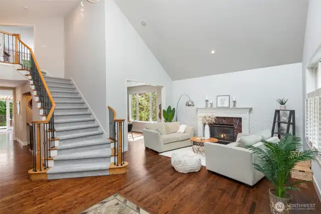 Wide staircase with iron banisters leading to the second floor.
