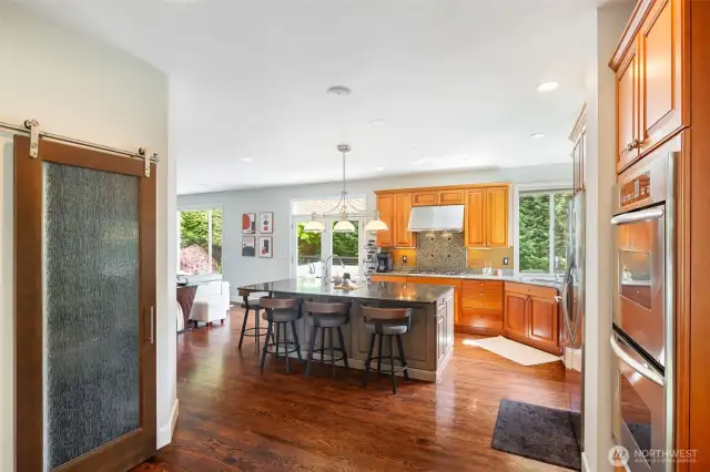 Walk-in panty with sliding glass door.