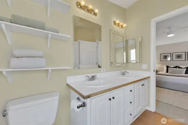 Spacious primary bath with dual sinks and clean finishes.
