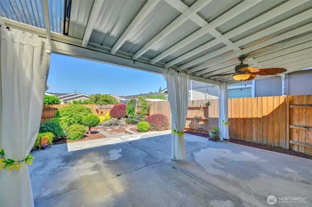 Dine in comfort with views of the tranquil backyard.