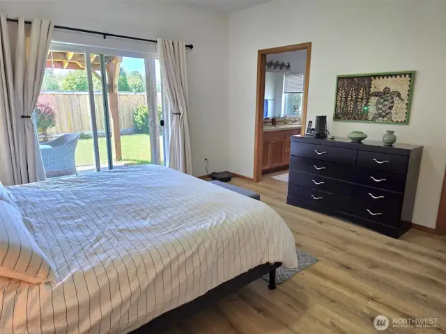 Nice primary bedroom with walk out to patio.