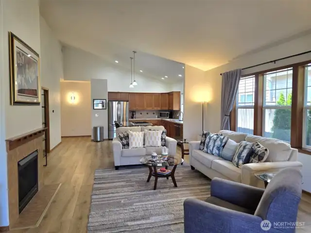 Dramatic vaulting, open living space.  Cozy fireplace and wood laminate throughout.