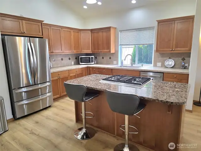 Granite and Tile, full backsplash, high end appliances.
