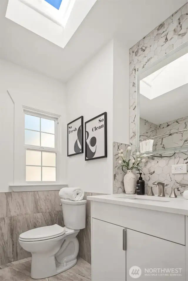 A skylight in the bathroom brings in extra light making this a stunning bath.
