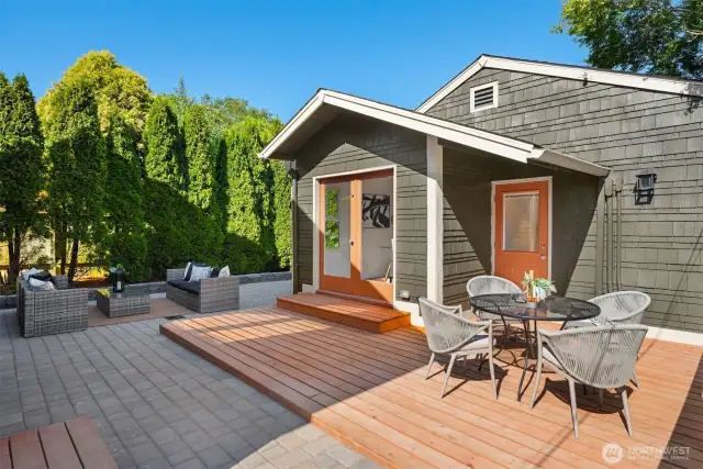 A wrap around paver patio is just off the wood deck and goes around to the front garage.