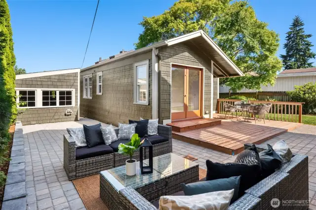 The front detached garage is seen from the backside here. The paver patio wraps all the way around to the front.