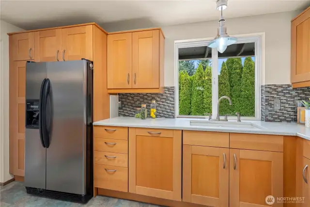 Enjoy looking into your backyard while doing the dishes.