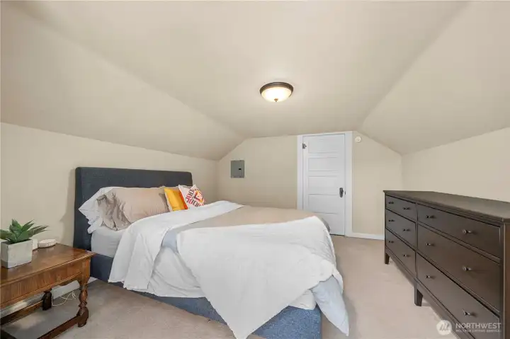 Upstairs bedroom offers extra privacy and is next to a spacious, spa-like bath.