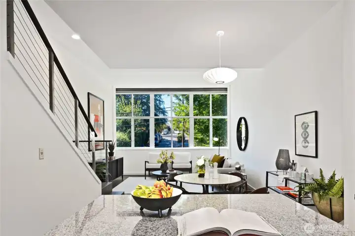 Expansive windows, framed by mature trees, invite serene green views while offering a sense of natural privacy.