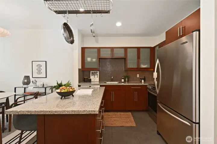 The center kitchen island offers great prep space and allows your guests to be part of the culinary experience.