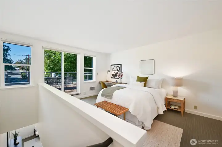 As you reach the top of the staircase, go left to the second bedroom which can also be used as an office, play space, music room, guest room and so much more. The sliding doors lead to the 400 sq ft deck. The large closet in this room also houses the full size laundry. Notice how the indoor and outdoor spaces merge so well-another characteristic of MCM design.
