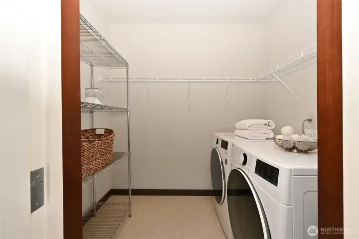 Expansive closet in the secondary bedroom with full size laundry.