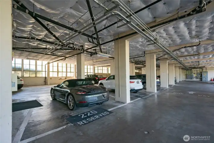 This home offers TWO garage parking spaces-unlike any other home in the Industrial Arts Building. The spaces can be rented out to other homeowners in the QAHS. Both spots are ideal as they are close to the entrance of the garage and also the door leading to the building lobby.  Spaces 220 and 201 are deeded to this home. This space is the closest to the entry lobby.