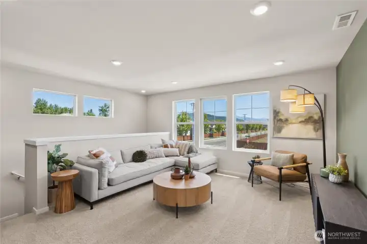 Large loft area perfect for media space, game room, or playroom. Actual home is under construction and finishes, materials, and colors will vary. See site agent for details.