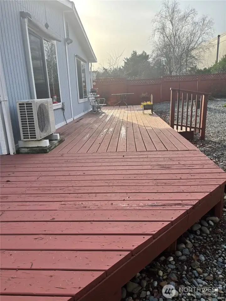 Deck wraps around 3 sides of home