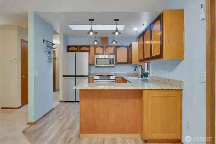 Kitchen has incredible storage and skylight