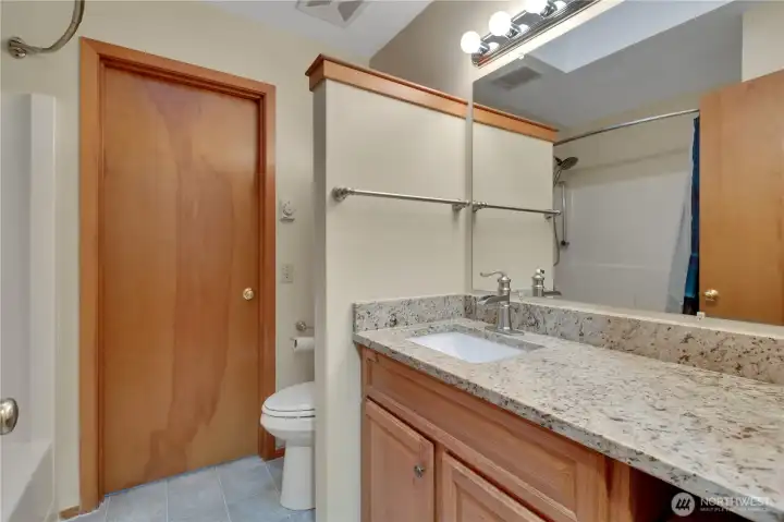 ensuite bathroom with toilet and another shower. This bathroom accessible to 2nd bedroom on this floor across the hall