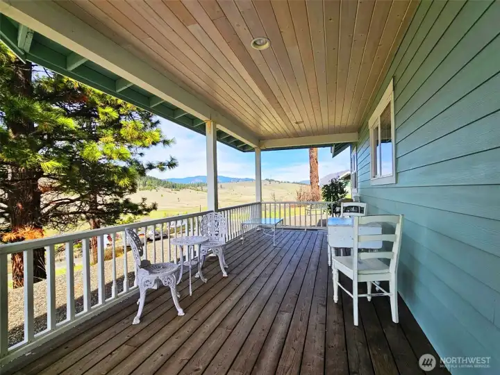 Fabulous views in all directions from this covered front porch. Grab morning coffee and watch the sunrise to the east or hang with a good book on a warm summer day and take in all the natural beauty that abounds.