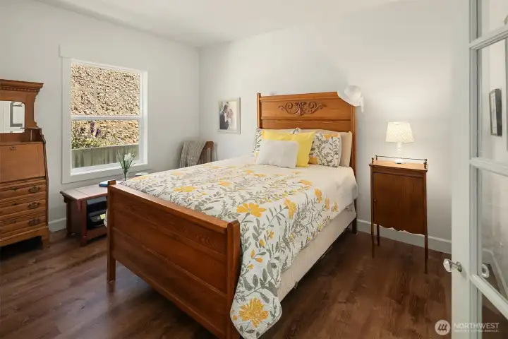 Stroll through French doors into this comfortable primary bedroom with plenty of space for all your favorite bedroom furniture. So much natural light flows through this home, you will love it!