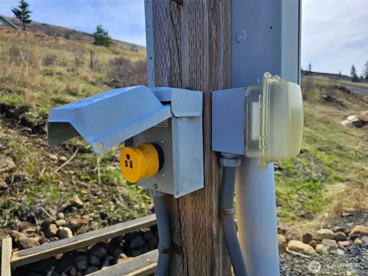 RV hookup, power and water to lower cleared area, room for barn, small shop or garage