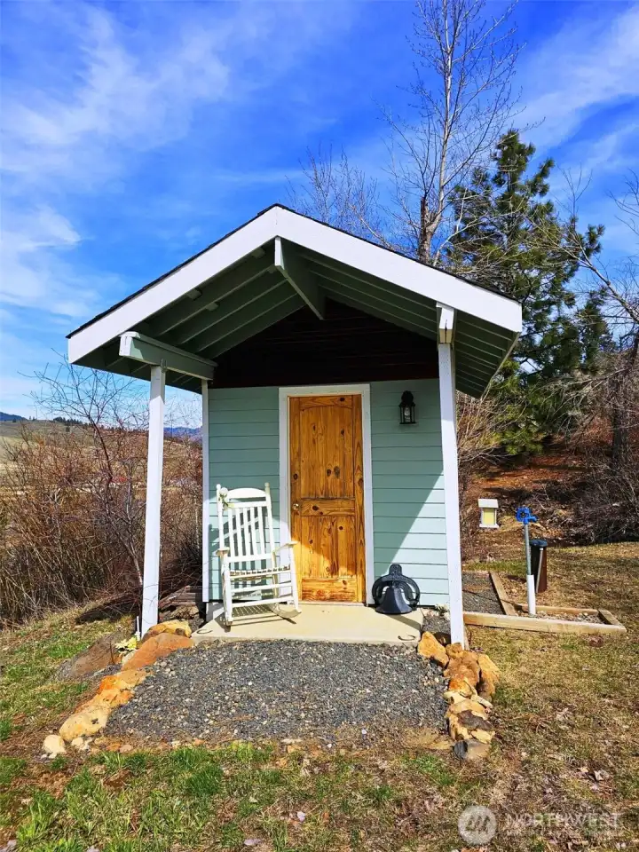 Darling well house complete with frost free water spigot for watering yard. Grow a wonderful garden in this area! Tons of sunshine for flowers or vegetables!