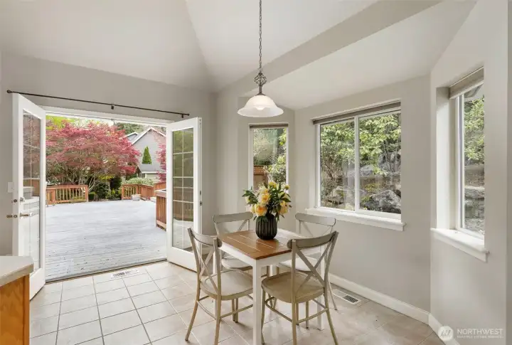Breakfast nook with French doors leading to a huge deck.