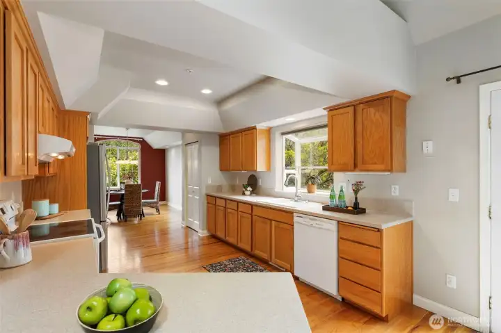 Large kitchen with tons of storage and solid surface countertops.