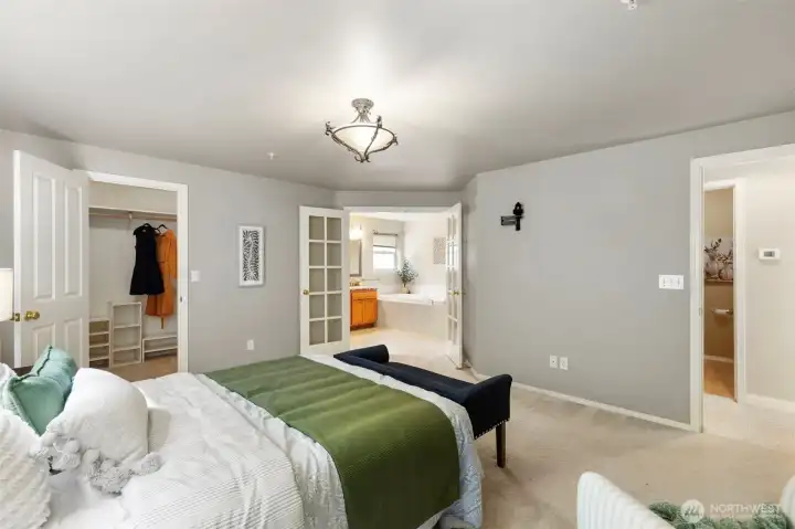 Main floor primary with walk-in closet...French doors leading to 5 piece ensuite.