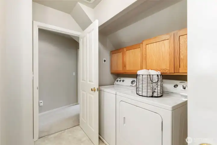 Upstairs laundry in guest bathroom.
