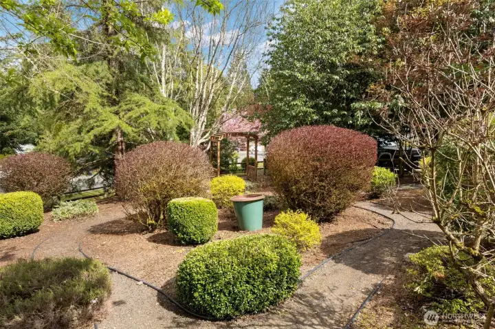 Winding paths, mature landscaping and sweet spots to relax and take in nature!