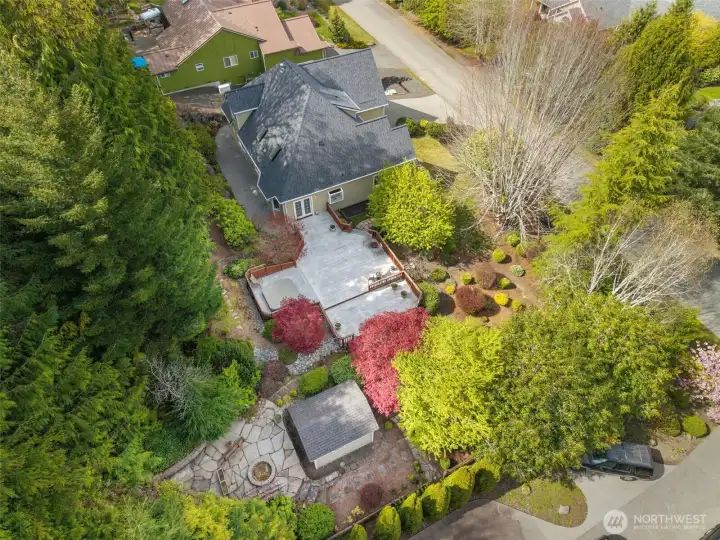 Winding paths, mature landscaping, storage shed, huge deck, and sweet spots to relax and take in nature!