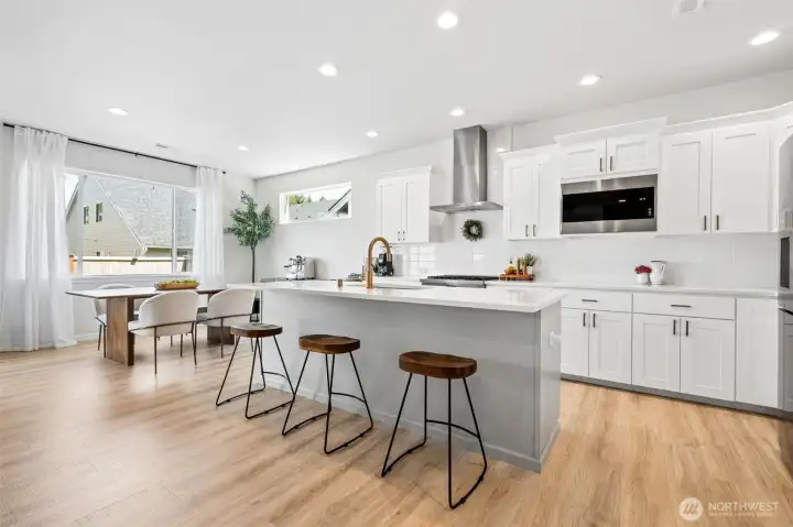 Wait till you see the high end appliances. This elegant kitchen showcases tons of extra cabinet space.