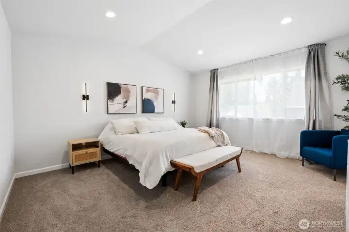 Vaulted ceilings in this massive primary suite.